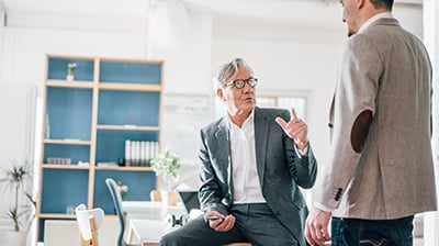 Two business men having a discussion in an office 